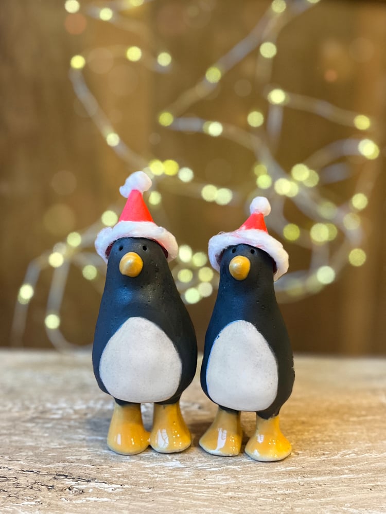 Image of ceramic penguin sculptures