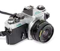 Image 1 of Nikon FE 35mm SLR film camera with 28mm F2.8 MC Wide angle lens AS-4 strap #1385