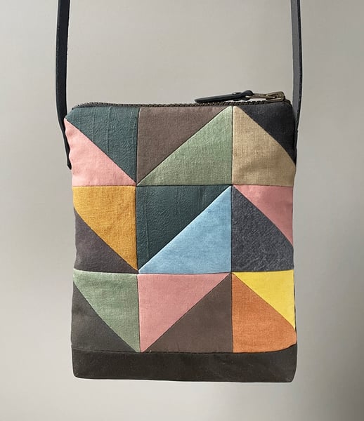 Image of Indigo triangle, patchwork shoulder bag with plant-dyed panels and leather strap