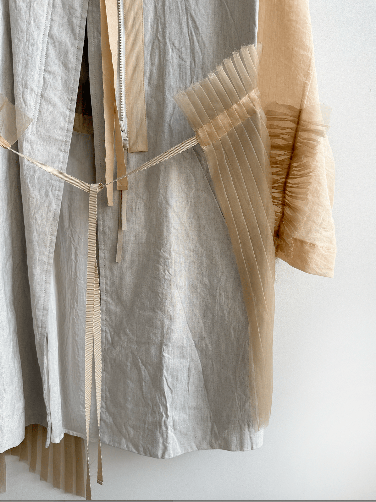 Prototype - bi-fabric pleated-back overcoat