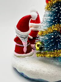 Image 4 of Santa and Mrs Claus celebrating around the Christmas Tree