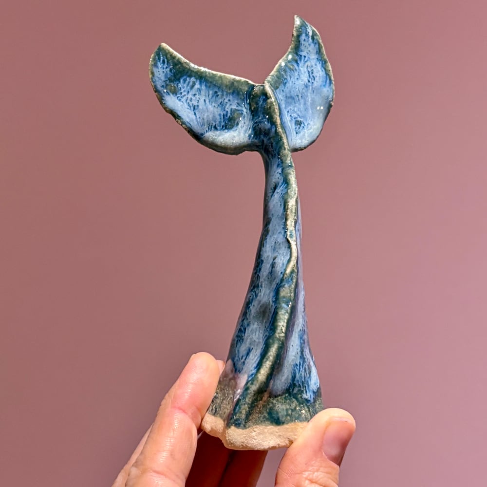 Image of Stormy whale tail