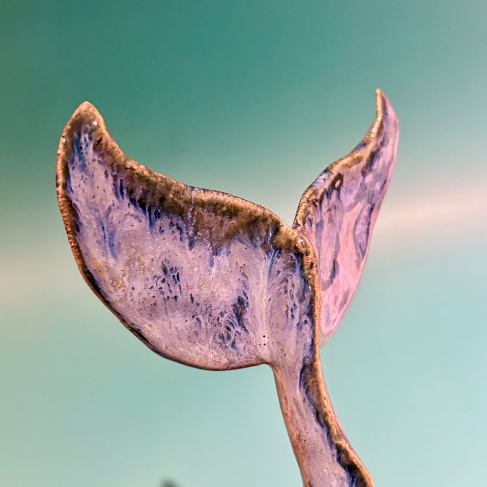 Image of Stormy whale tail