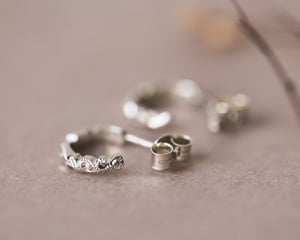 Image of 9ct White gold floral carved hoop earrings