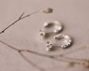 Image of 9ct White gold floral carved hoop earrings