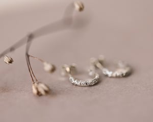 Image of 9ct White gold floral carved hoop earrings