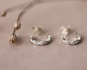 Image of 9ct White gold floral carved hoop earrings