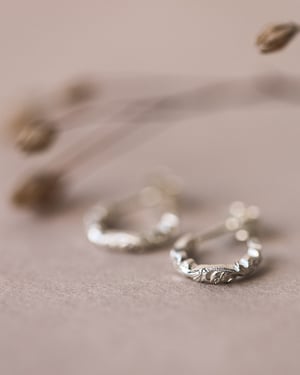 Image of 9ct White gold floral carved hoop earrings