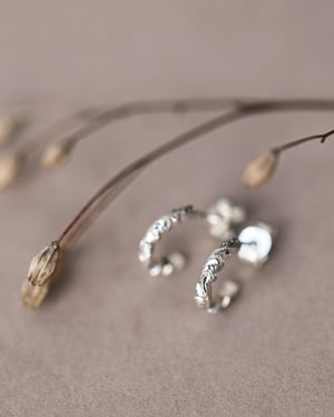 Image of 9ct White gold floral carved hoop earrings