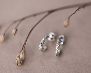 Image of 9ct White gold floral carved hoop earrings