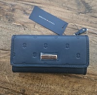 Image 1 of Tommy Hilfiger Women's Faux Leather Logo Debossed Checkbook Wallet Clutch Bag in Dark Blue. 