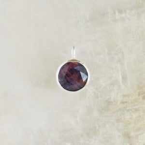 Image of Pinkish Sapphire round star cut silver necklace