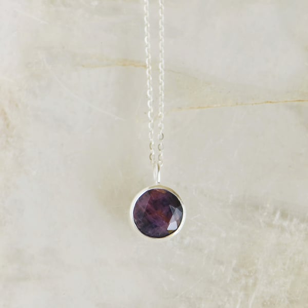 Image of Pinkish Sapphire round star cut silver necklace