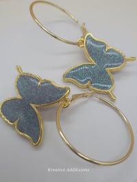 Image 1 of On the gold hoop Lavendar sparkle Butterfly Earrings