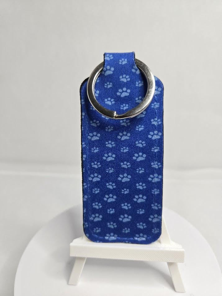 Image of Blue Paw Print Chapstick Holder – Because Your Lips Deserve More Than a Pocket Black Hole!