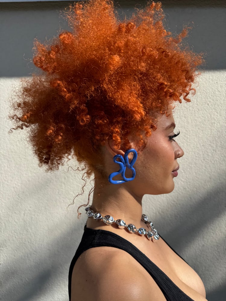 Image of blue cursive piece