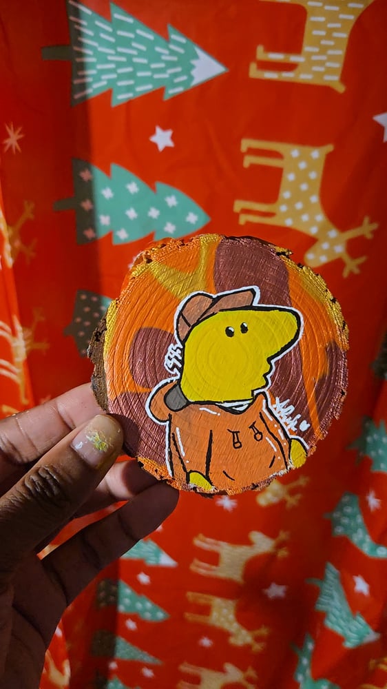 Image of Charlie on a Wooden Slice 