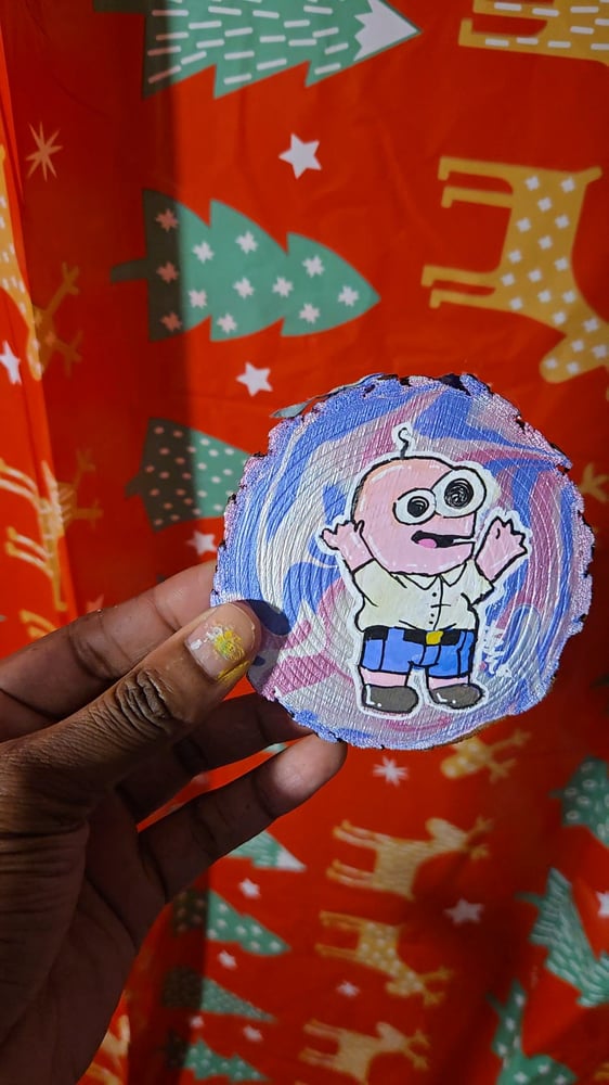 Image of Pim on a Wooden Slice 