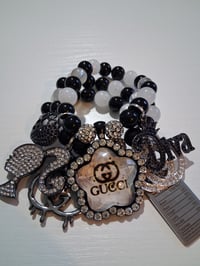 Image 1 of Lady with ponytail and Gucc