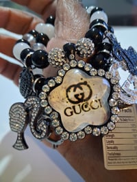 Image 2 of Lady with ponytail and Gucc