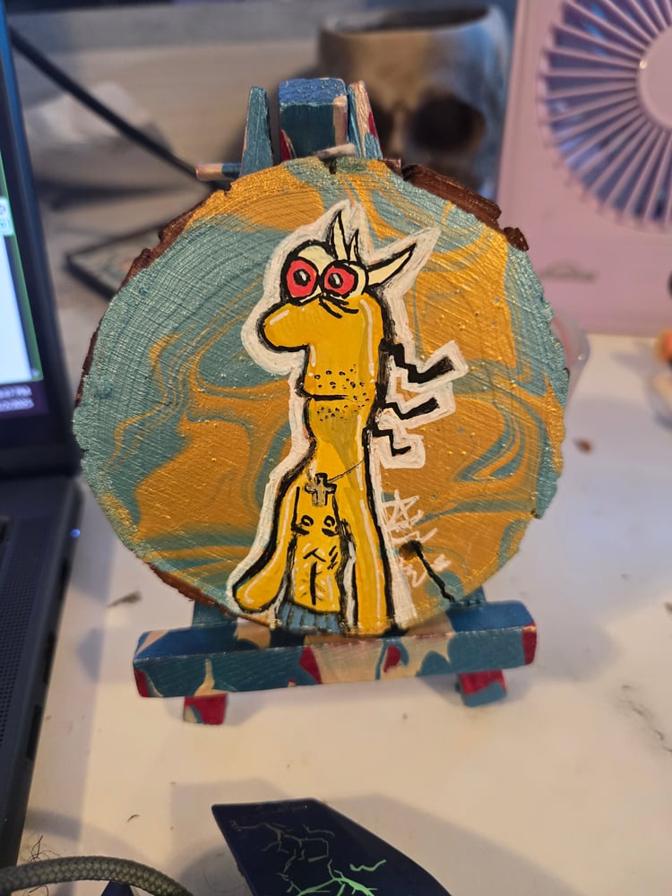 Image of Dj Spit on Wooden Slice 