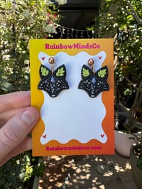 Image 1 of Starlight Fox Polymer Clay Earrings- Black Fox Dangles with Sparkly Blue Shimmer & Leaf Details