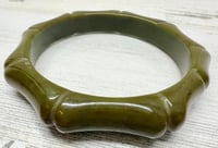 Image 1 of Vintage 1940s Olive Green Carved Bamboo Style Bakelite Bangle Bracelet