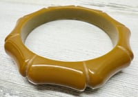 Image 1 of Vintage 1940s Mustard Yellow Carved Bamboo Style Bakelite Bangle Bracelet