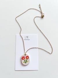 Collier pendentif double fleur céramique