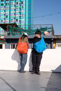 Image 2 of LW - Reversible Wavy Plaid Newspaper Bag (Wavy Green-Orange)