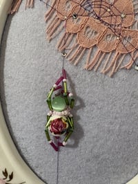 Image 3 of Floral Lace Spider crawling up Web