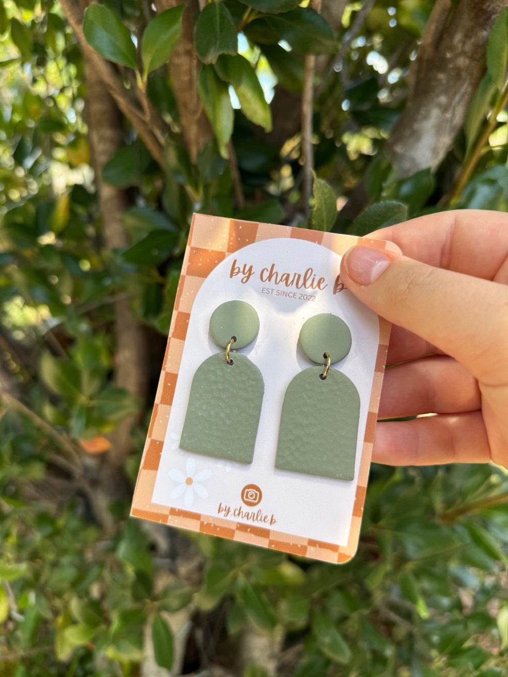 Image of dark green batted arch dangles 