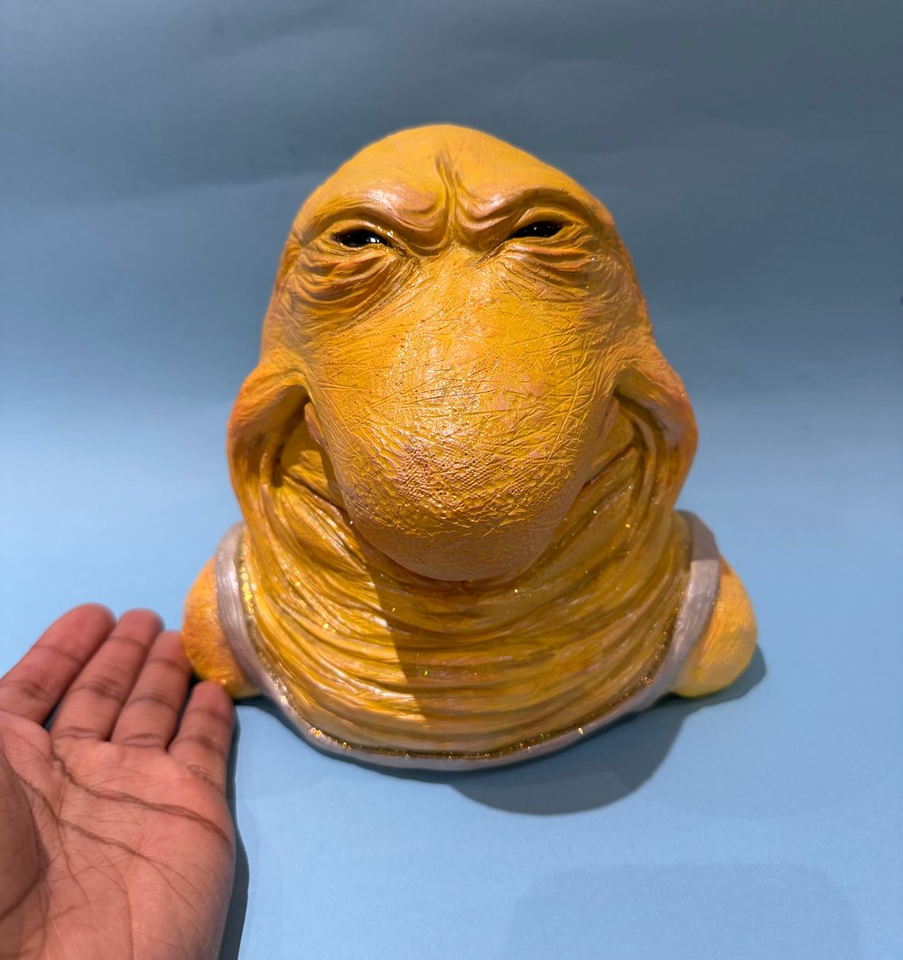 Evil faced Charlie sculpture 