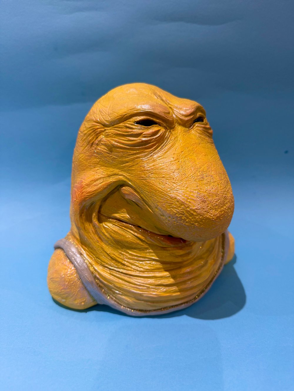 Evil faced Charlie sculpture 