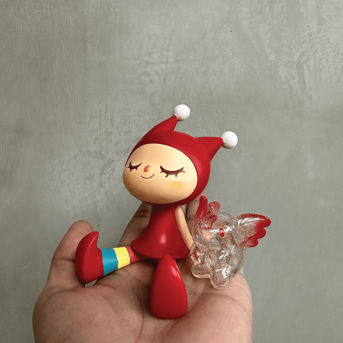 GreenieRedinHand.png?auto=