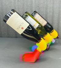 Image 1 of 🧱🍷 Brick-Style Wine Bottle Holder – Lego Arm–Inspired Wine Display 🍷🧱
