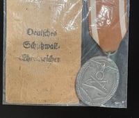 Image 1 of WW2 (Nazi Germany) West Wall Medal w/Original Issue Packet - Authentic Issue