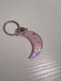Porte clef lune effet holographique rose et transparente