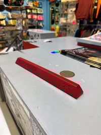 Image 1 of Slappy Red parking curb