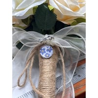 Image 1 of Bridal Bouquet Charm: Forget-Me-Not Flowers on Pearlescent Background | Silver Bowknot Brooch