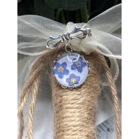 Image 5 of Bridal Bouquet Charm: Forget-Me-Not Flowers on Pearlescent Background | Silver Bowknot Brooch