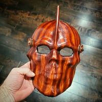 Image 3 of Woodgrain Skull Hawk mask with elastic strap.