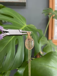 Image 2 of Gold Oval Garden Quartz Crystal Necklace