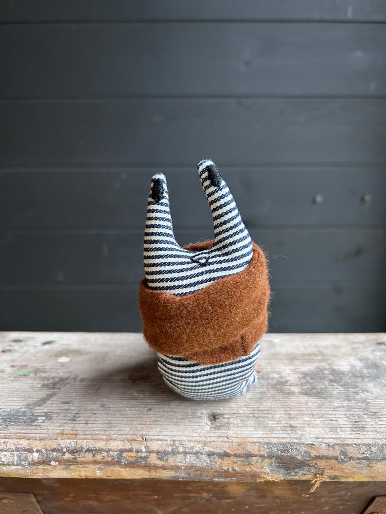 Image of Small Handmade Orange Linen Snail Wearing A Brown Woollen Scarf