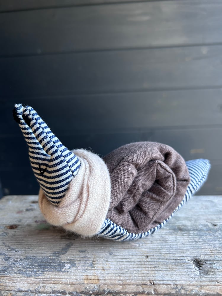 Image of Small Handmade Brown Linen Snail Wearing A Cream Woollen Scarf
