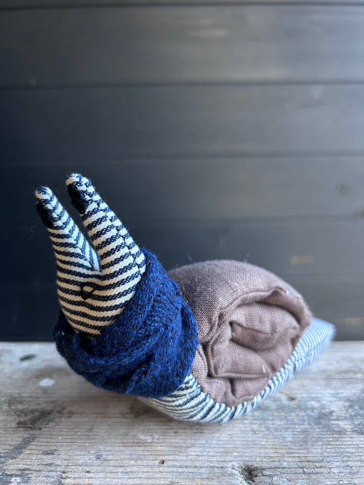 Image of Small Handmade Brown  Linen Snail Wearing A Blue Woollen Scarf