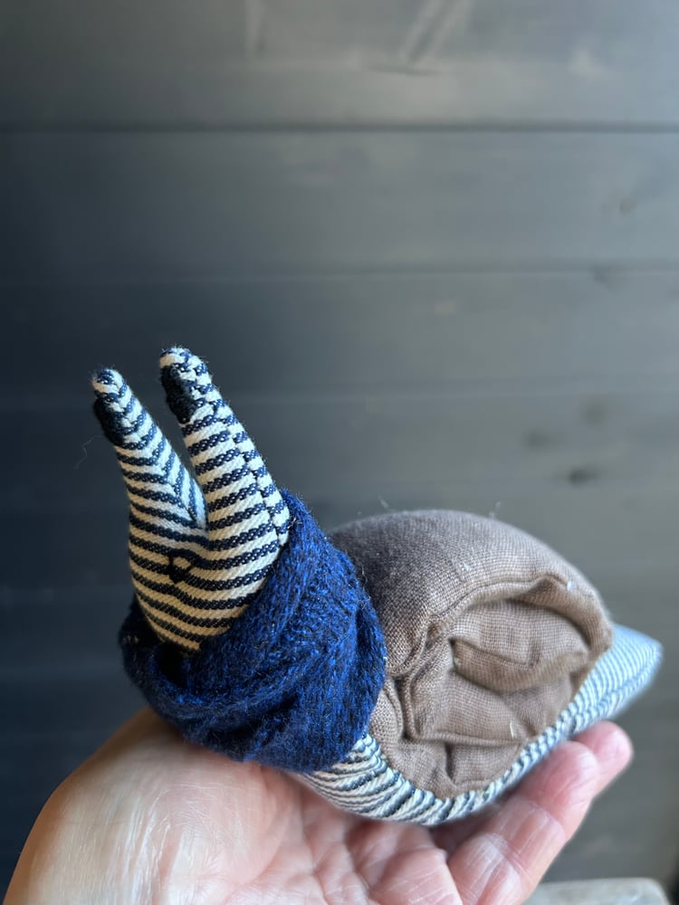 Image of Small Handmade Brown  Linen Snail Wearing A Blue Woollen Scarf