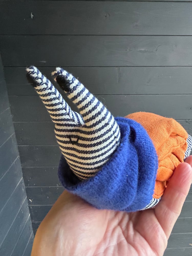 Image of Small Handmade Orange Linen Snail Wearing A Blue Woollen Scarf