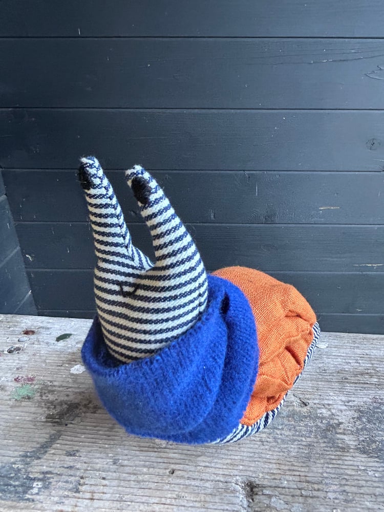 Image of Small Handmade Orange Linen Snail Wearing A Blue Woollen Scarf