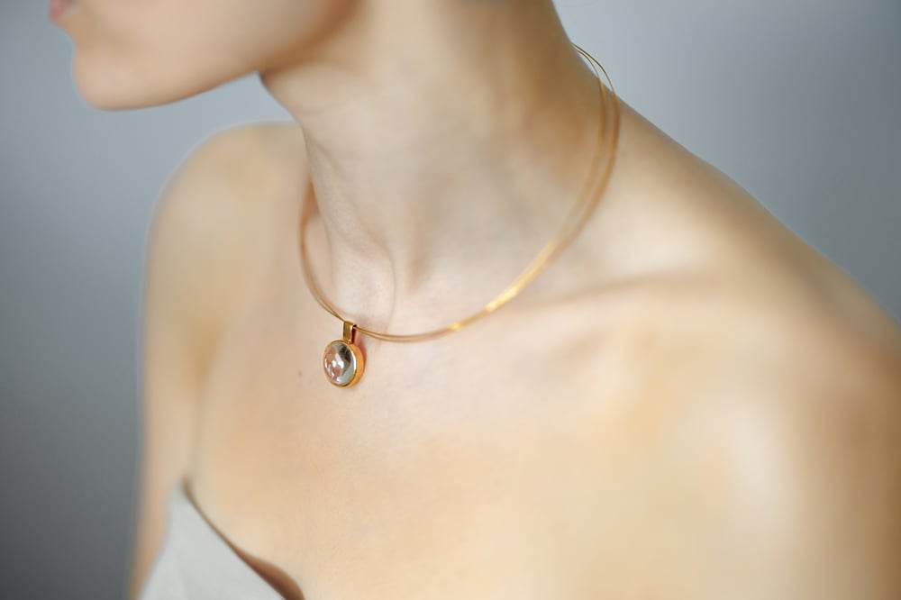 Image of "Bringer of the sun" gold plated silver pendant with rock crystal  · SOLIFER ·